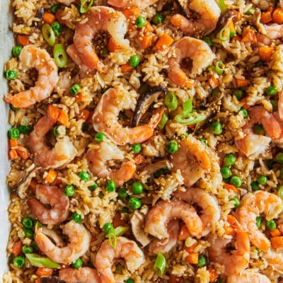 Leftover rice, pan fried with cooked shrimp and peas, shiitake mushrooms, carrots, onions a sauces.